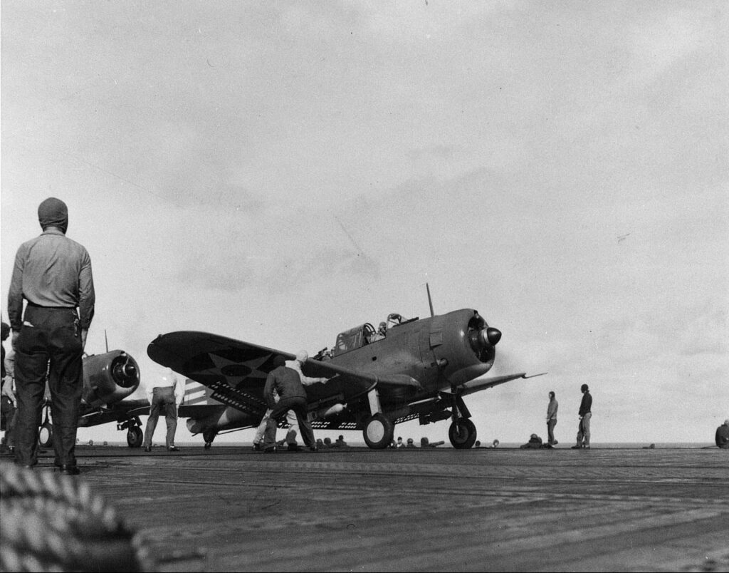 A bomb-laden SBD-2 Dauntless dive bomber prepares to take off from the U.S. carrier Enterprise during the raids on February 1.