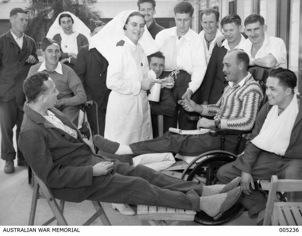 Jack Greaves, on the right with his arm in a sling, recovering at a hospital in Helwan, Egypt in January 1941.