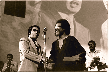 Jim Jones receives a Martin Luther King Jr. Humanitarian Award from Pastor Cecil Williams in 1977.