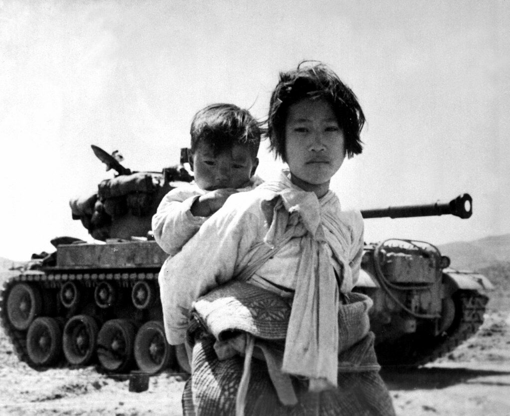 Korean Woman in Front of American Tank - Korean War